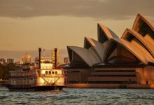 Luxury Sydney dinner cruise sailing past the Opera House at sunset
