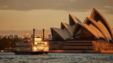 Luxury Sydney dinner cruise sailing past the Opera House at sunset